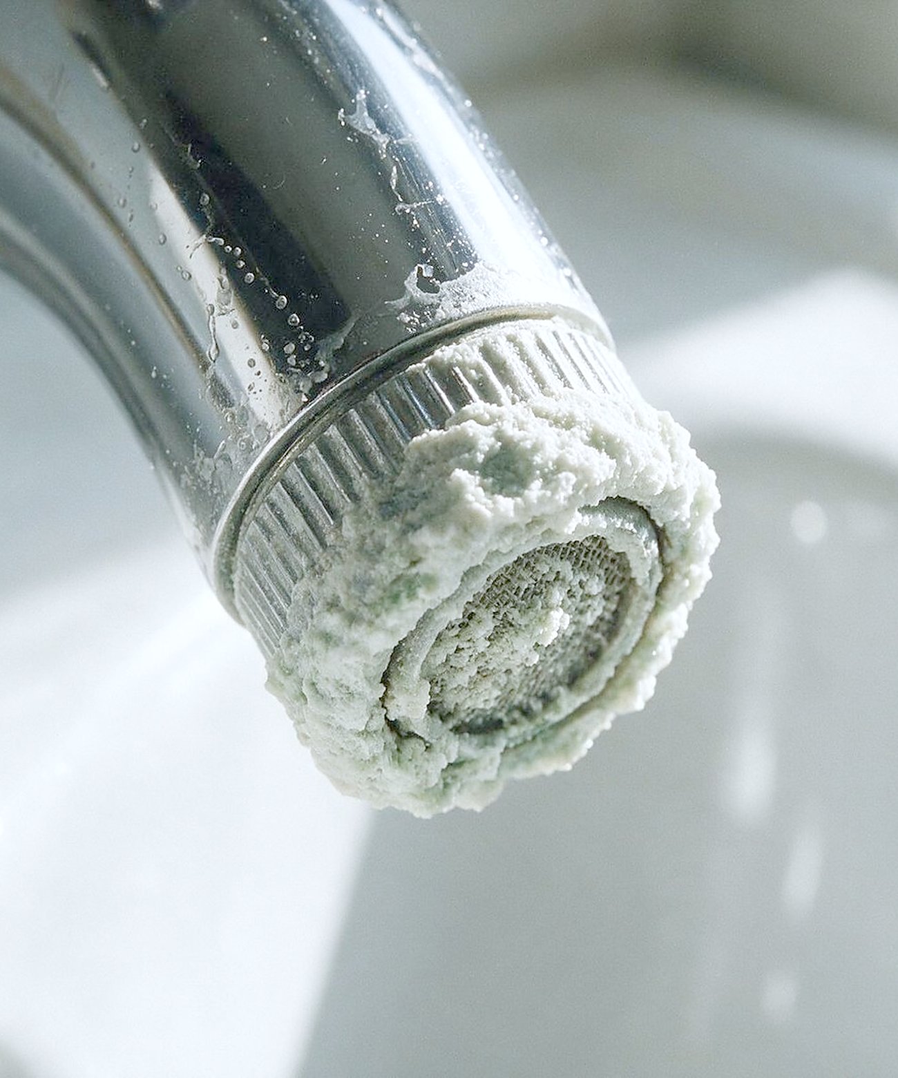 Limescale crusted on a faucet aerator
